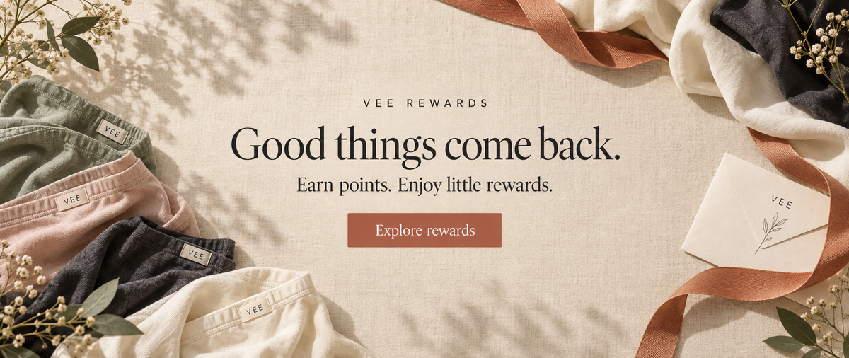 Vee Rewards. Good things come back. Earn points. Enjoy little rewards. Explore rewards. Soft fabrics and terracotta ribbon on warm ivory linen.